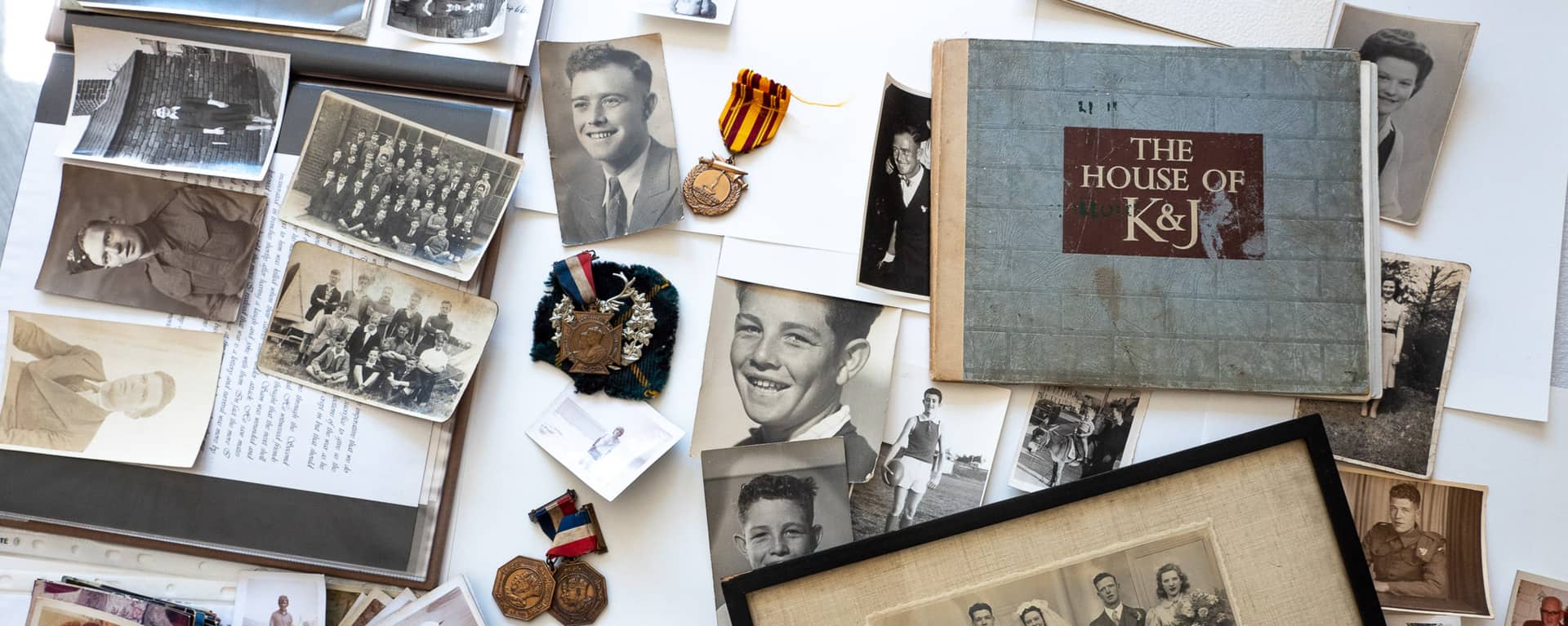 A range of photos and memorabilia from Mike Poulton's family collection. 