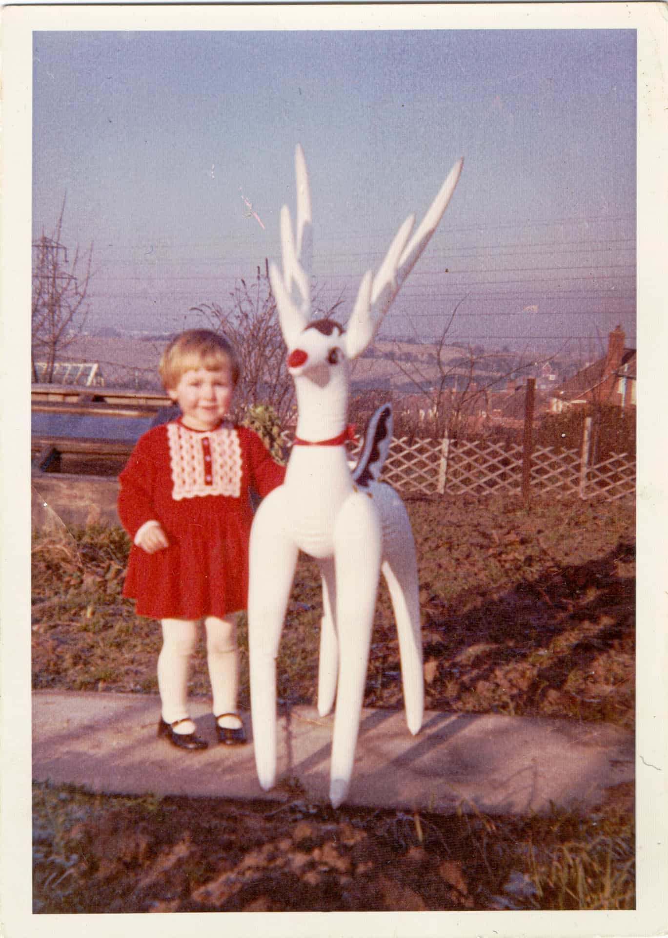 Gaynor Beesley with Rudolph in the garden of the family home in Ettingshall Park, Wolverhampton, Christmas Day, 1966