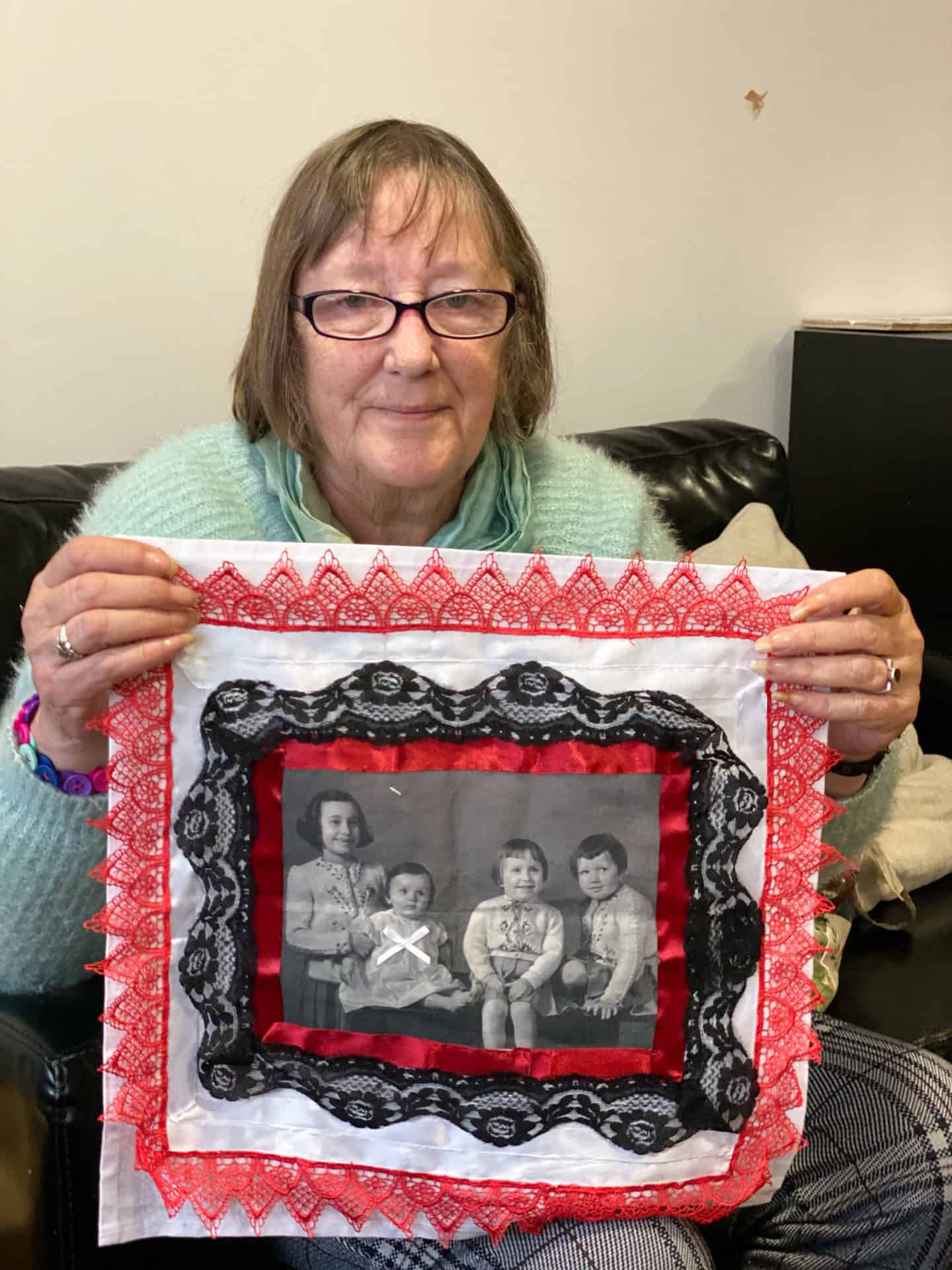 Barbara with her finished embroidery Sisters at Gather café Dudley 2020
