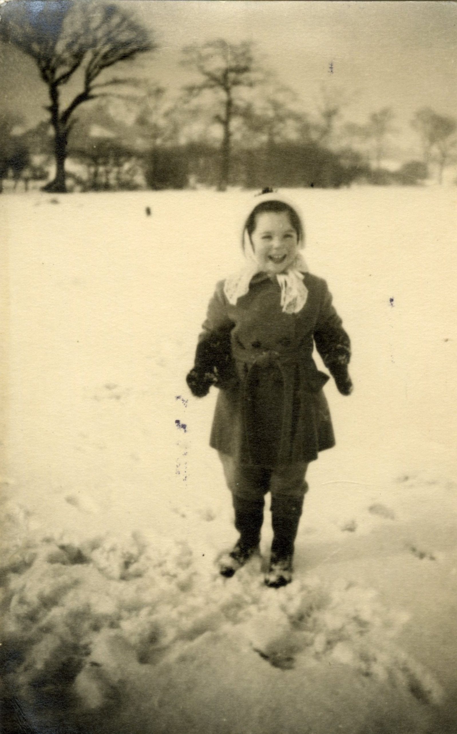 Me smiling in the snow that covered the field at the bottom of Wells Road, 1947